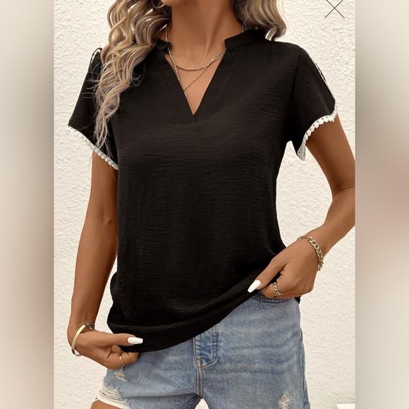 This blouse is a black patchwork short sleeve V neck blouse. - Picture 3 of 5